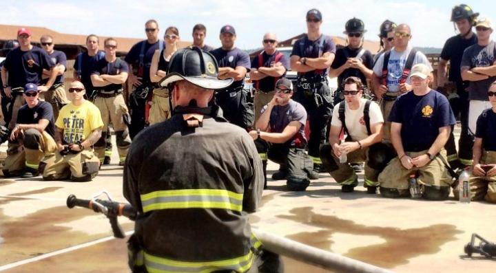 fire instructor in front of firefighters