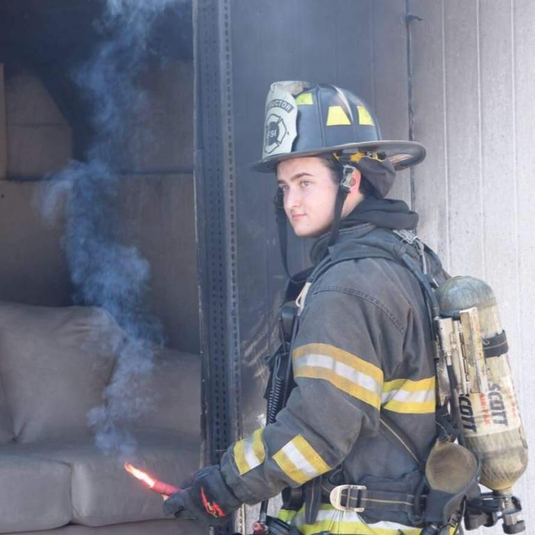 Adam Quiat holding flare