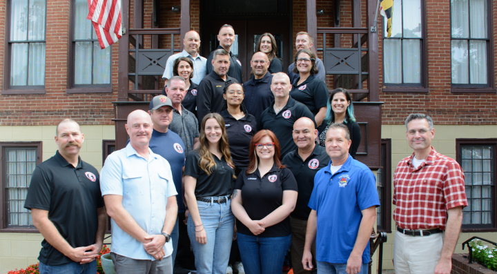 TAC Members standing in a  group photo 