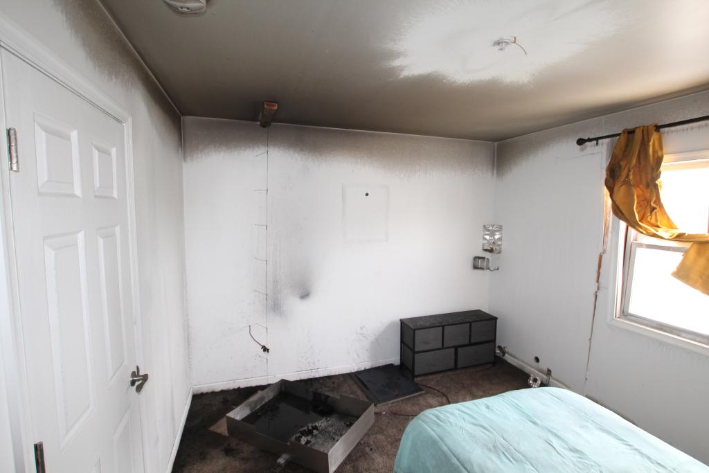 Post-experiment photo shows how the sprinkler limited fire spread